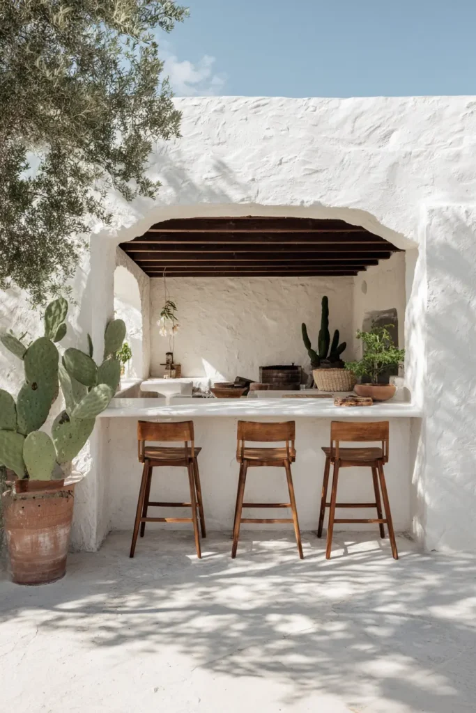 Chic Outdoor Kitchen With Bar Seating